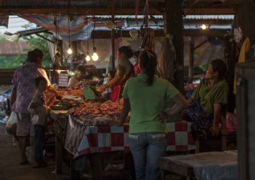 Butcher in a market, Phonsaad, Laos