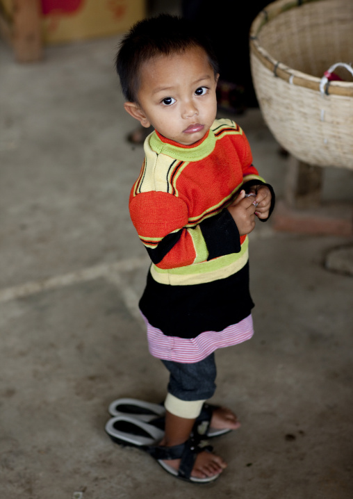 Khmu minority girl with big shoes, Xieng khouang, Laos