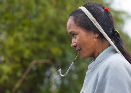 Khmu minority woman smoking pipe, Xieng khouang, Laos