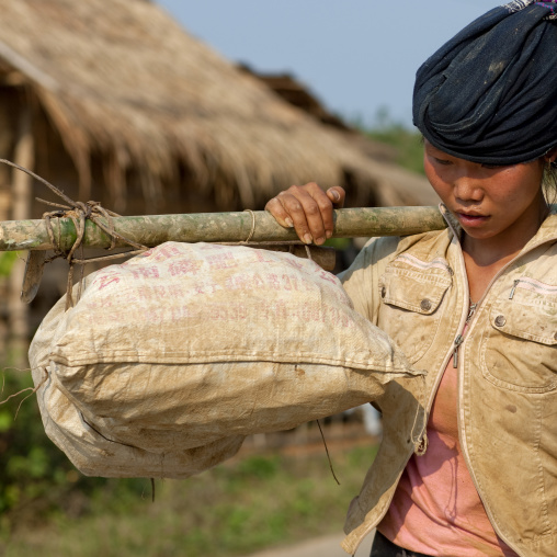 Woman carrying stuff, Luang namtha, Laos