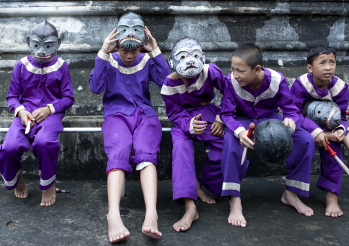 Kids with masks during pii mai lao new year celebration, Luang prabang, Laos