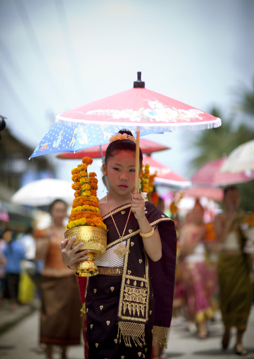 Girl in traditional clothing during pii mai lao new year celebration, Luang prabang, Laos