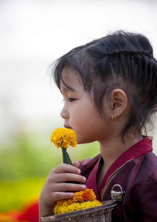 Girl in traditional clothing during pii mai lao new year celebration, Luang prabang, Laos