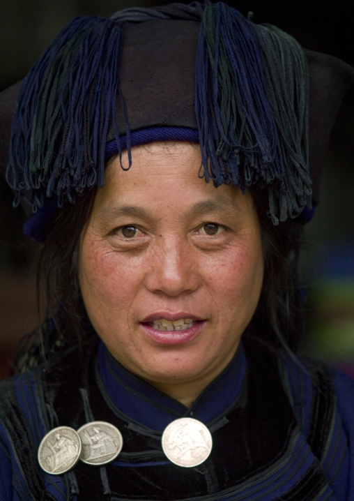 Woman with old coins on a necklace, Champasak, Laos