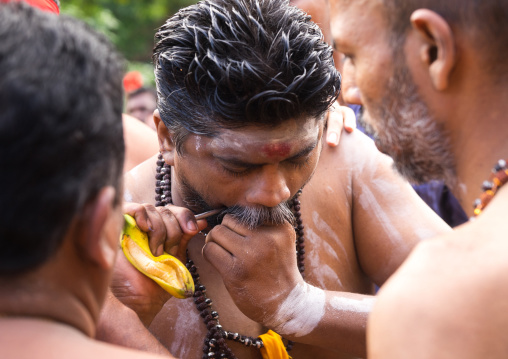 A Priest Piercing Himself With A Skewer At Thaipusam Hindu Festival At Batu Caves, Southeast Asia, Kuala Lumpur, Malaysia