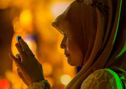 Muslim Woman In Annual Thaipusam Hindu Religious Festival In Batu Caves Taking Pictures, Southeast Asia, Kuala Lumpur, Malaysia