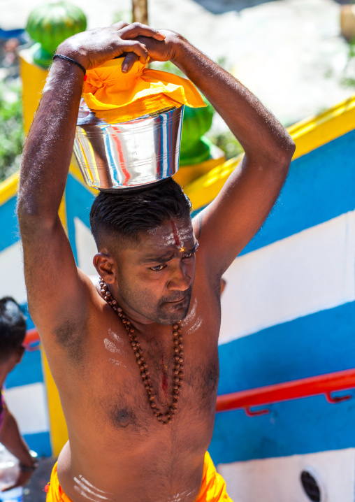 Hindu Devotee Man Carrying Water Jug On His Head In Annual Thaipusam Religious Festival In Batu Caves, Southeast Asia, Kuala Lumpur, Malaysia