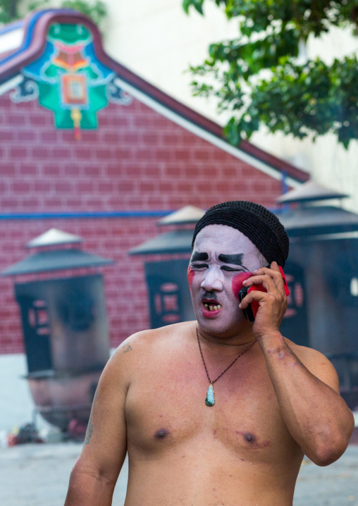 Chinese Opera Actor Making A Call On Mobile Phone At Goddess Of Mercy Temple, Penang Island, George Town, Malaysia