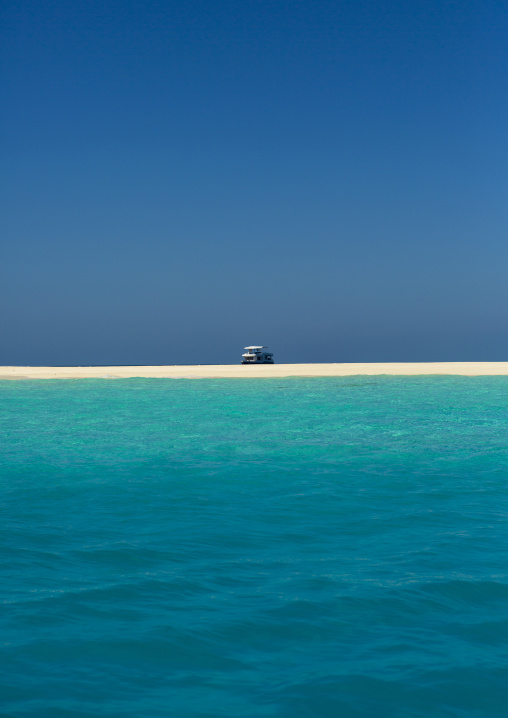 Yacht In Front Of A Beach In Soneva Fushi Resort, Baa Atoll, Maldives