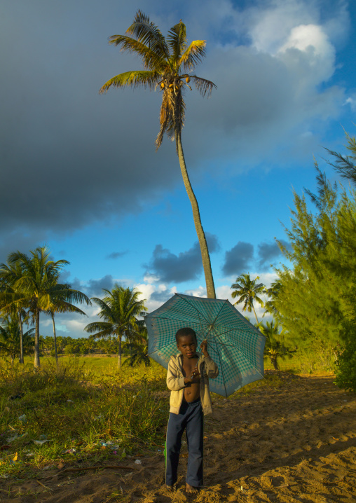 Boy With An Umbrella In The Country, Inhambane, Inhambane Province, Mozambique