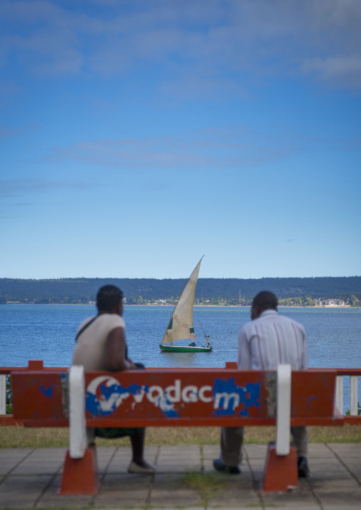 Couple On A Bench Looking At A Dhow, Inhambane, Inhambane Province, Mozambique