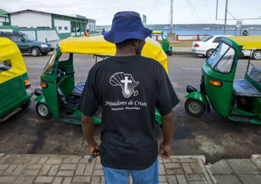 Man With A Christian Tshirt In Front Of Taxis, Inhambane, Inhambane Province, Mozambique