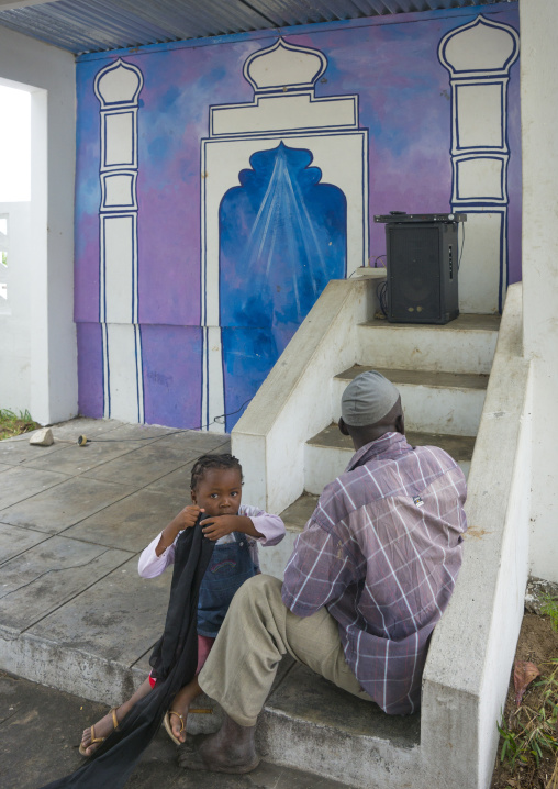 Father and daughter in front of a mosque, Inhambane Province, Mozambique