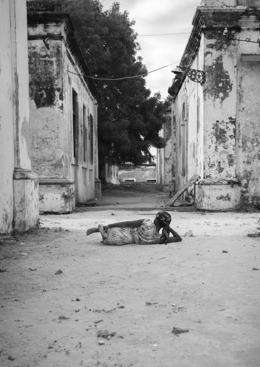 Woman Lying On The Ground Inside The Old Hospital, Ilha de Mocambique, Nampula Province, Mozambique