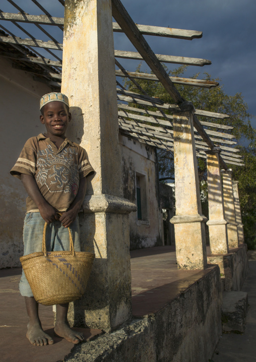 Kid Standing In Front Of An Old Portuguese Colonial House, Ibo Island, Cabo Delgado Province, Mozambique