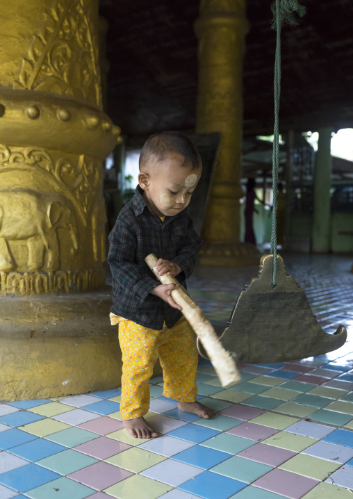 Litlle Boy Ringing A Bell In A Temple, Mrauk U, Myanmar