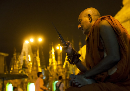 Monk Calling On A Mobile Phone At Shwedagon Pagoda, Yangon, Myanmar