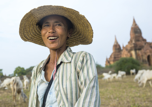 Sheperd Woman In Front Of An Old Temple, Bagan, Myanmar