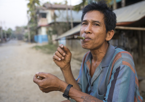 Man Smoking A Cigar, Thandwe, Myanmar