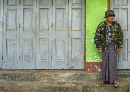 Man In Army Uniform Standing In The Street, Sittwe, Myanmar