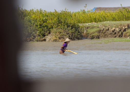 Woman Fishing In A River With A Net, Mrauk U, Myanmar