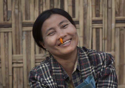 Woman With Orange Peel In The Nose To Bring Freshness, Mrauk U, Myanmar