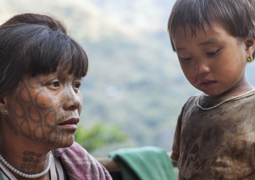 Tribal Chin Woman From Muun Tribe With Tattoo On The Face With Her Daughter, Mindat, Myanmar