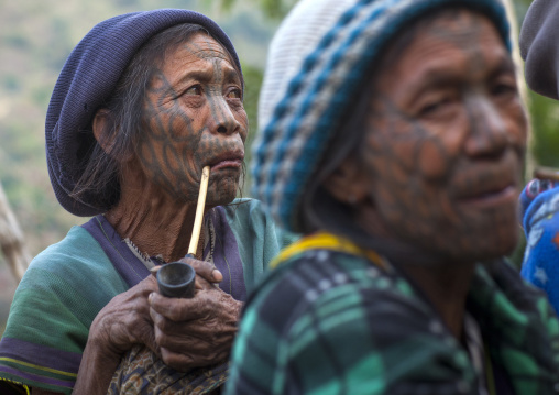 Tribal Chin Women From Muun Tribe With Tattoos On The Face Smoking, Mindat, Myanmar