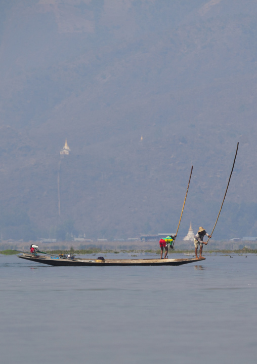Traditional Fishermen With Fish Trap In Boat, Inle Lake, Myanmar