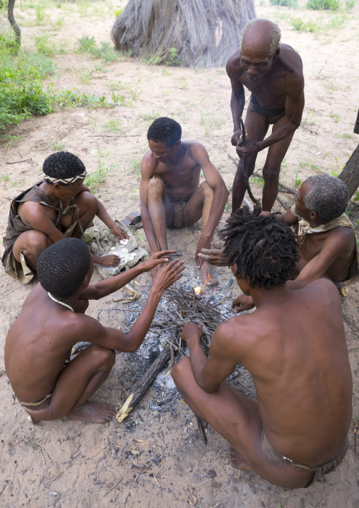Bushman People Around A Fire In A Traditional Village, Tsumkwe, Namibia