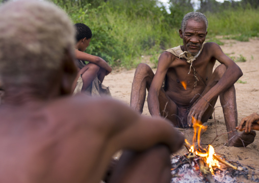 Bushman People Around A Fire In A Traditional Village, Tsumkwe, Namibia