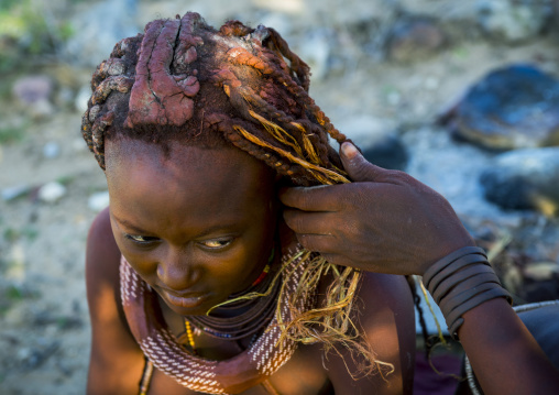 Himba Woman Making Dreadlocks On Her Friend, Epupa, Namibia
