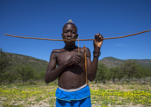Himba Man Playing Bow Instrument, Epupa, Namibia