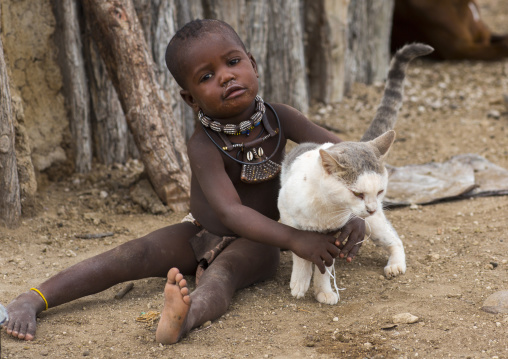 Himba Child Playing With A Cat, Epupa, Namibia