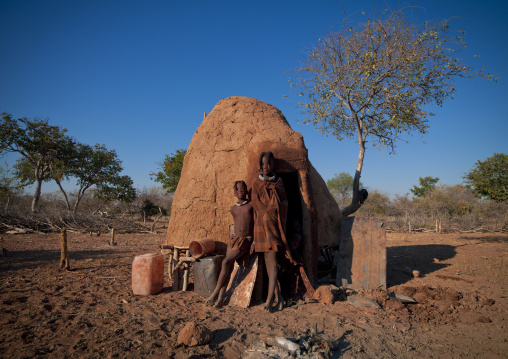 Himba Girls Leaning On A Hut, Karihona Village, Ruacana Area, Namibia