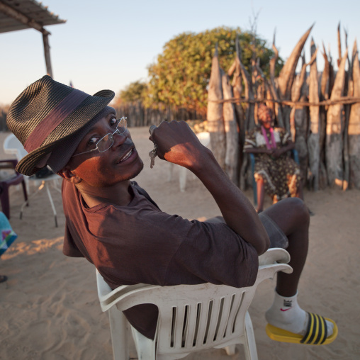 Ovambo Man On A Plastic Chair, Ruacana Area, Namibia