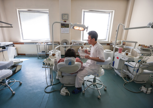North Korean dentist and his patient in an hospital, Pyongan Province, Pyongyang, North Korea