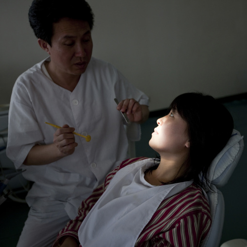 North Korean dentist and his patient in an hospital, Pyongan Province, Pyongyang, North Korea