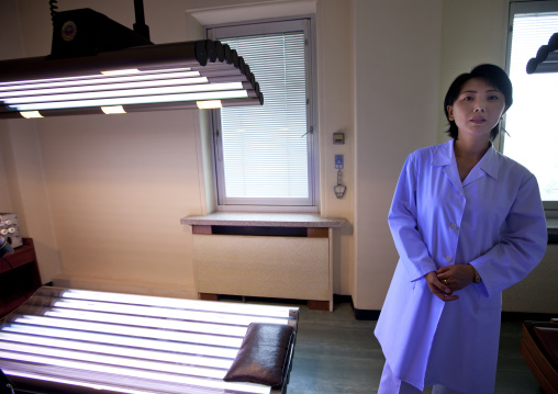 North Korean doctor near an ultra violet light bed in maternity hospital, Pyongan Province, Pyongyang, North Korea