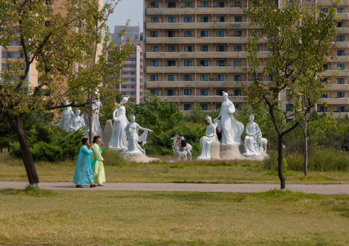 North Korean women in a park with statues, Pyongan Province, Pyongyang, North Korea