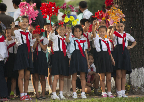 North Korean pioneers with flowers during the september 9 parade, Pyongan Province, Pyongyang, North Korea