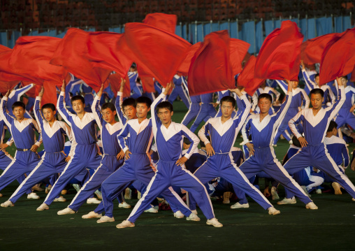 North Korean gymnasts with red flags during the Arirang mass games in may day stadium, Pyongan Province, Pyongyang, North Korea