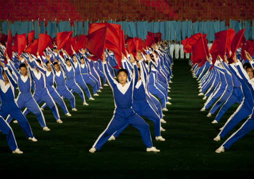 North Korean gymnasts with red flags during the Arirang mass games in may day stadium, Pyongan Province, Pyongyang, North Korea