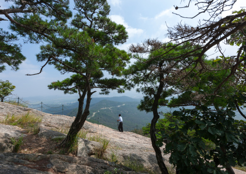 North Korean man walking in Moran park, Pyongan Province, Pyongyang, North Korea
