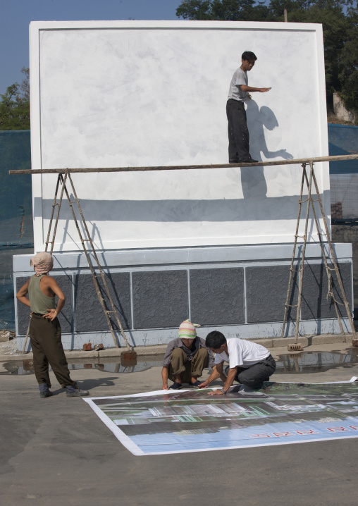 North Korean workers painting a new propaganda billboard, Pyongan Province, Pyongyang, North Korea