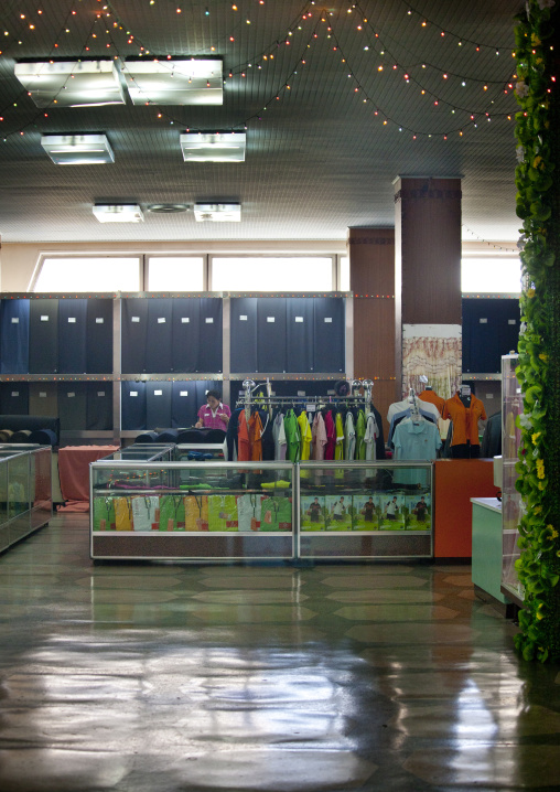 North Korean woman saleswoman in a clothes shop, Pyongan Province, Pyongyang, North Korea