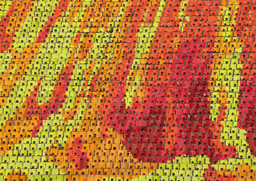 Flames made by children pixels holding up colored boards during Arirang mass games in may day stadium, Pyongan Province, Pyongyang, North Korea