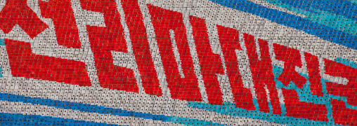 North Korean slogan made by children pixels holding up colored boards during Arirang mass games in may day stadium, Pyongan Province, Pyongyang, North Korea