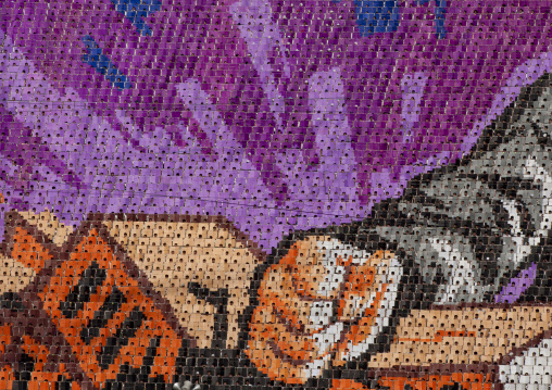 Man breaking a brick with the fist made by children pixels holding up colored boards during Arirang mass games in may day stadium, Pyongan Province, Pyongyang, North Korea