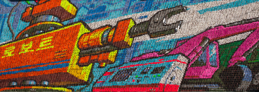 Industrial machines made by children pixels holding up colored boards during Arirang mass games in may day stadium, Pyongan Province, Pyongyang, North Korea